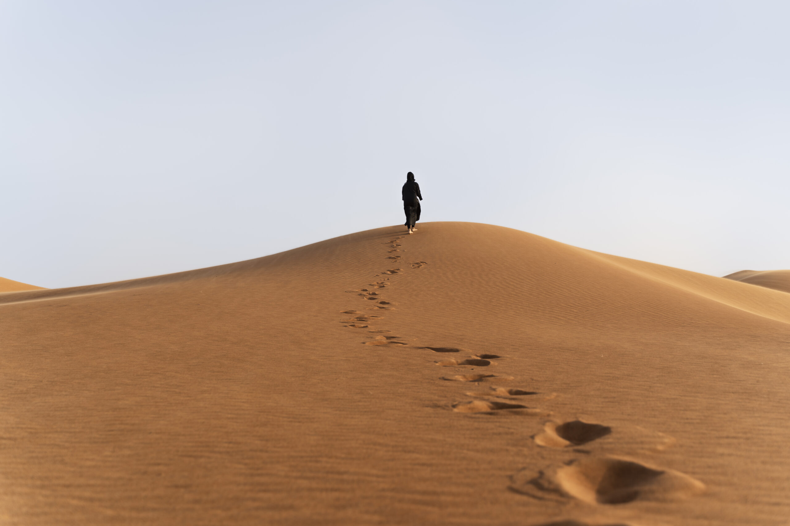 woman wearing hijab desert scaled